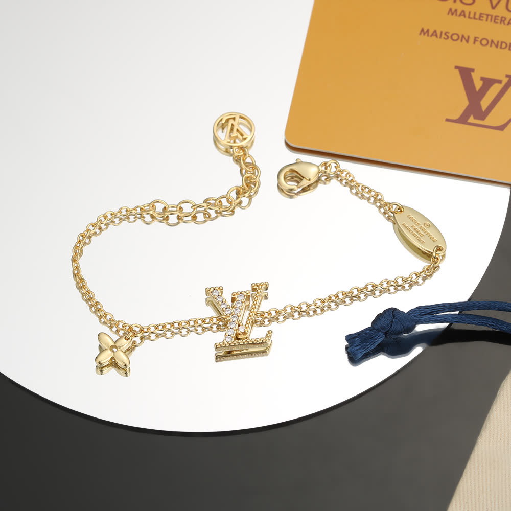 Louis Vuitton Gold Tone Bracelet with Monogram Charm
